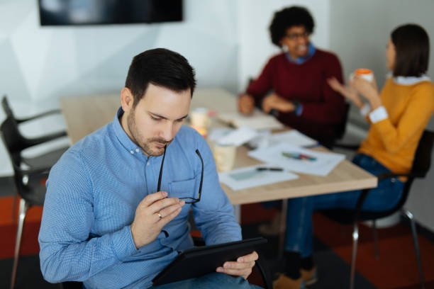 istock Young businessman using digital tablet in the office 1178920885