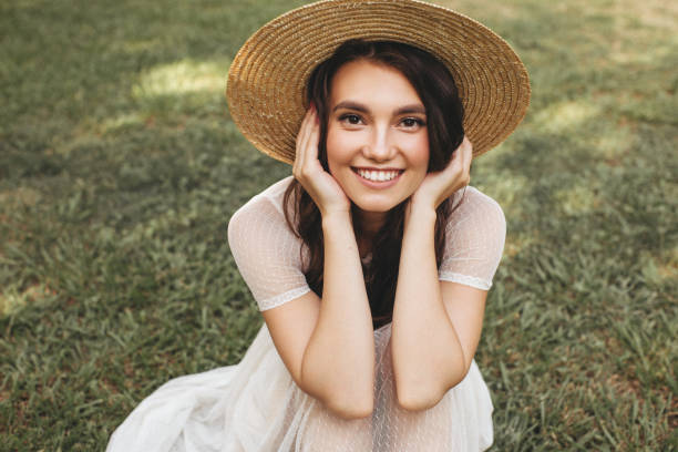 istock Happy girl sitting on the grass 1178920973