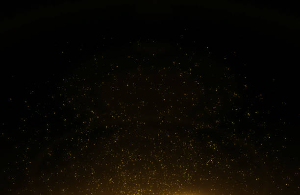 istock Abstract background of flickering gold particles and light flare 1178920979