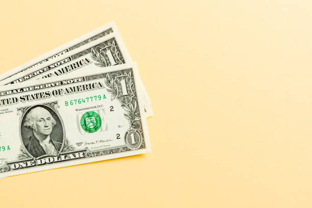 istock Stack of 1 dollar banknotes on colorful background. Top view of financial concept with empty space for your design 1178921409