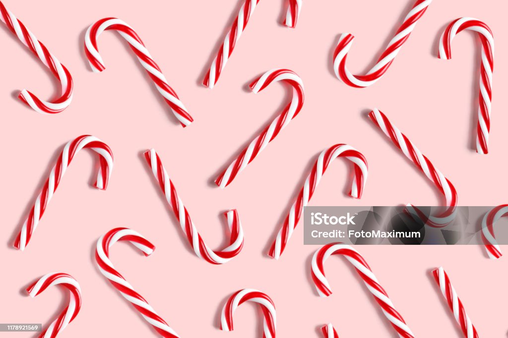 Candy cane for party design on pink background. Candy cane for party design on pink background. Top view copyspace Christmas Stock Photo