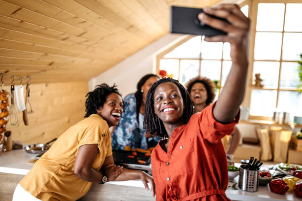 istock Joyful African women taking selfie while making lunch 1178925335