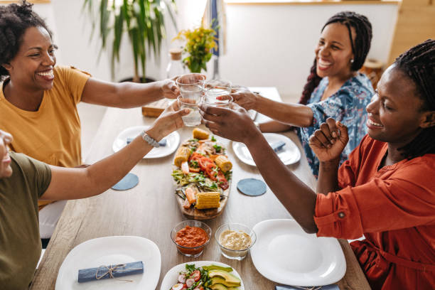 Non-alcoholic toast between African female friends