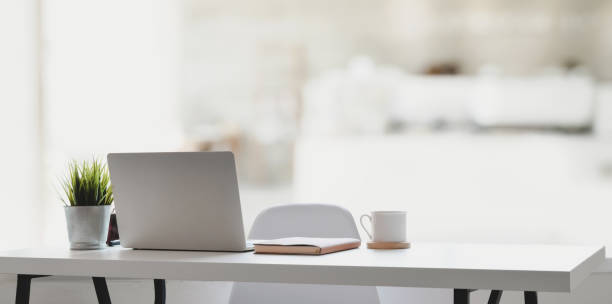 istock Comfortable workplace with laptop computer, coffee cup and office supplies 1178925516