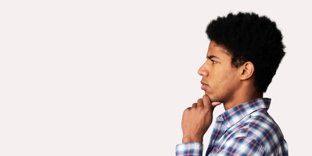 istock Thoughtful afro guy profile portrait on white background 1178925541