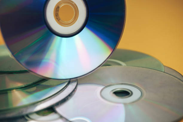 istock Close up Beautiful Old dirty CDs,DVD on yellow background. 1178925573