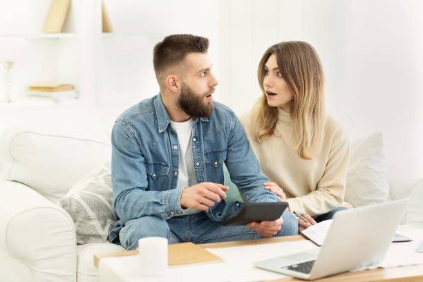 istock Shocked couple making financial revision at home 1178926318