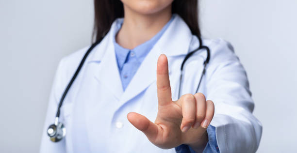 istock Unrecognizable Doctor Woman Pressing Key On Invisible Touchscreen, White Background 1178926401