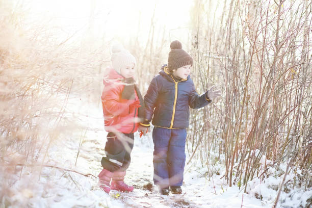istock Children in winter park play 1178926720