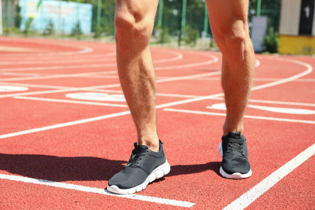 istock Man in sneakers on red athletic running track, close up 1178928158