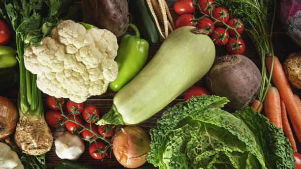 istock Top down view, mixed vegetable on wooden board desk 1178928342