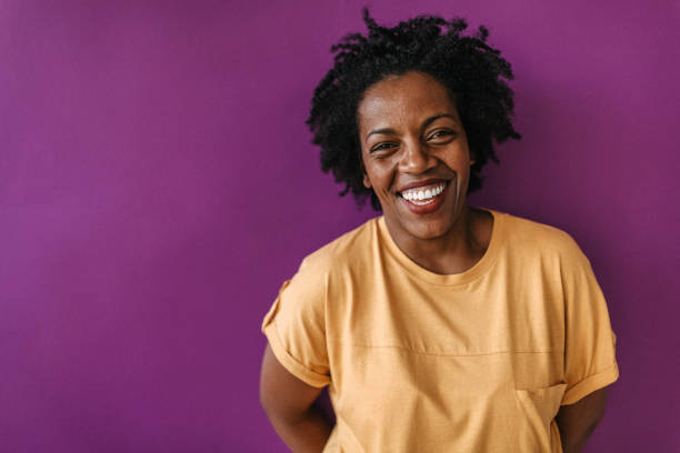 istock Beautiful laughter in front of purple wall 1178929022