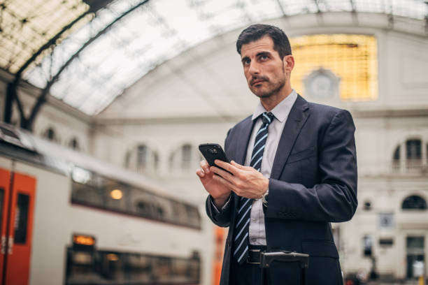 istock Businessman on train station 1178929221