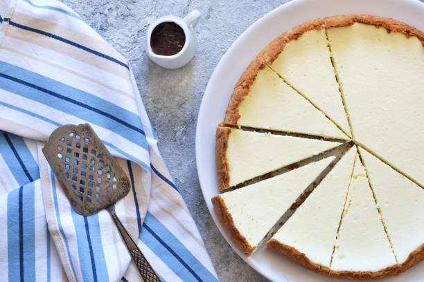 istock Classic New York cheesecake in a white plate on a concrete background. 1178929510