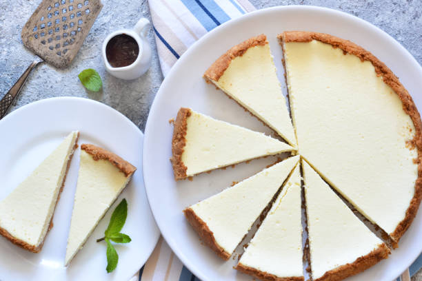 istock Classic New York cheesecake in a white plate on a concrete background. 1178929524