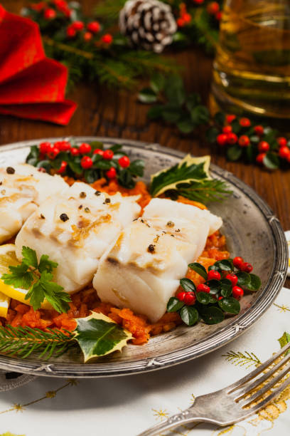 istock Christmas fish. Roasted cod pieces, served in vegetable sauce. 1178930894