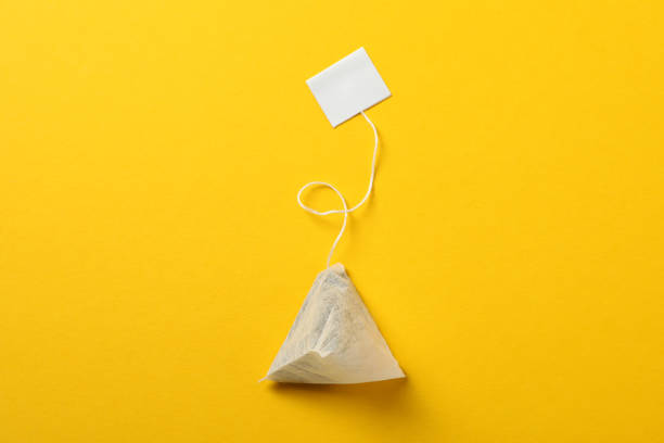 Teabag on orange background