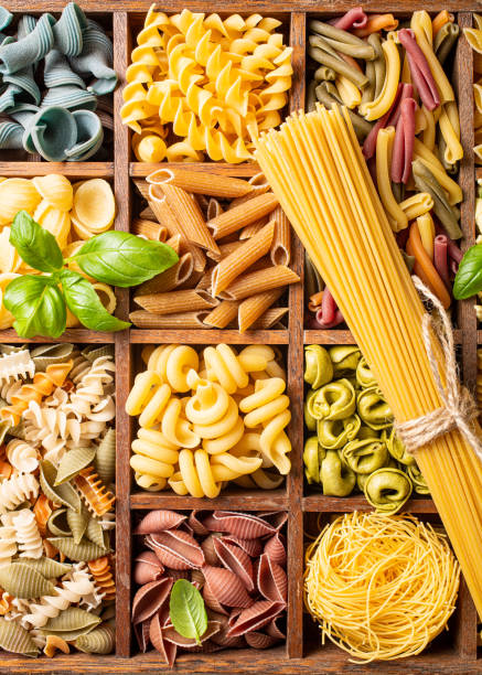 istock Assorted colorful italian pasta in wooden box 1178931143