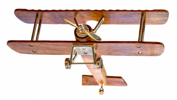 istock Wooden airplane model takeoff bottom view isolated on white background, for fitting into the sky. 1178933317