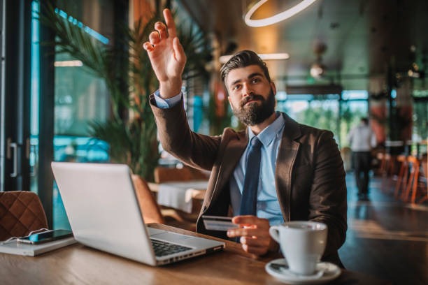 istock Business man drinking coffee in a cafe 1178933584