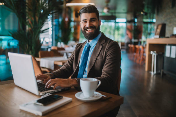 istock Business man drinking coffee and working in cafe 1178933609