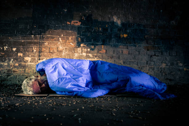 istock Homeless senior man sleeping rough in tunnel 1178933661