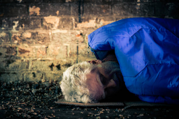 istock Homeless senior man sleeping rough in tunnel 1178933662
