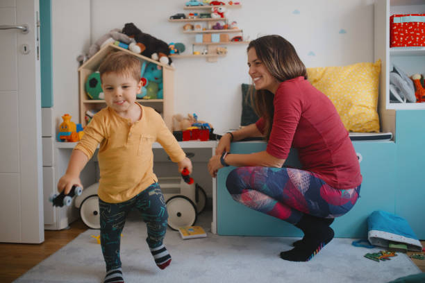 istock Mother and son playing in playroom 1178935237