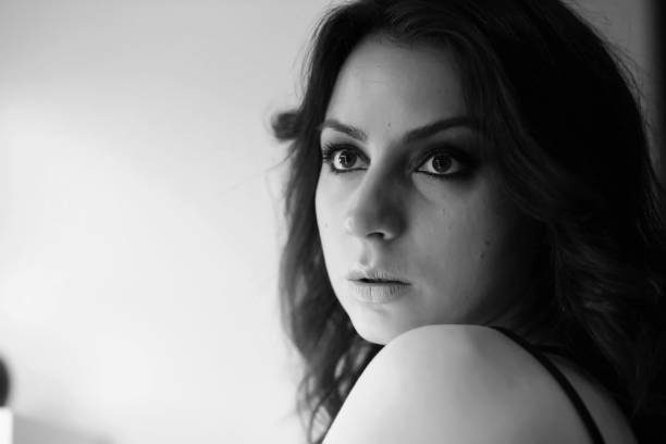 istock Girl doing makeup black and white 1178940514