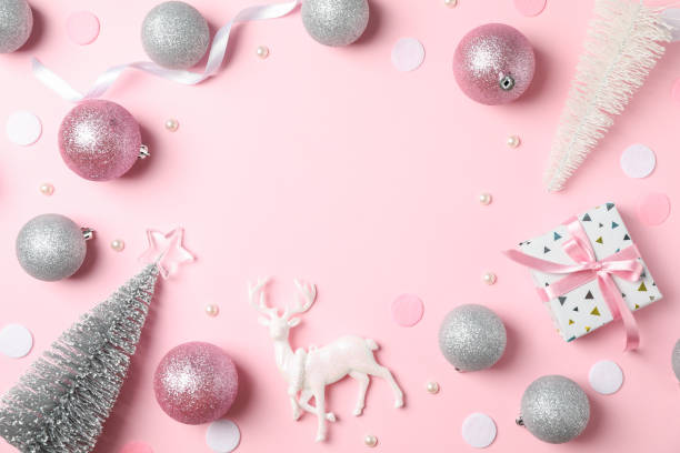 istock Christmas balls and presents on pink background, space for text 1178941835