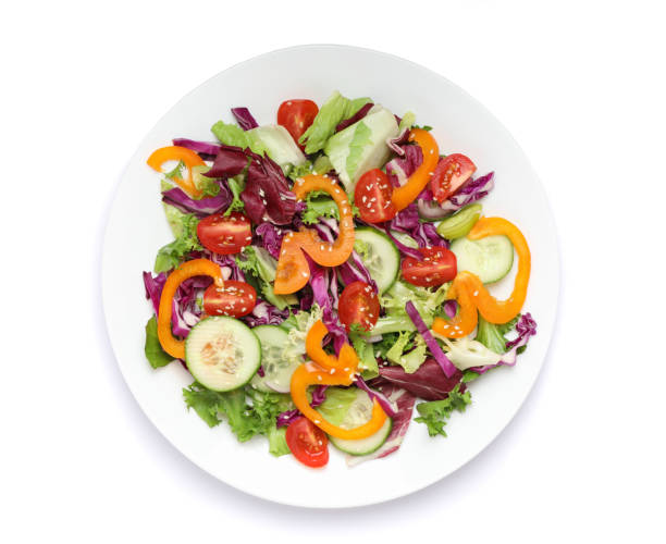 istock Plate with fresh salad isolated on white background 1178942320