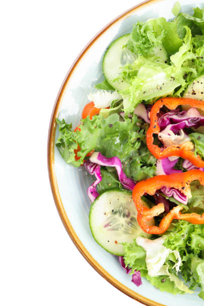 istock Plate with fresh salad isolated on white background 1178943023