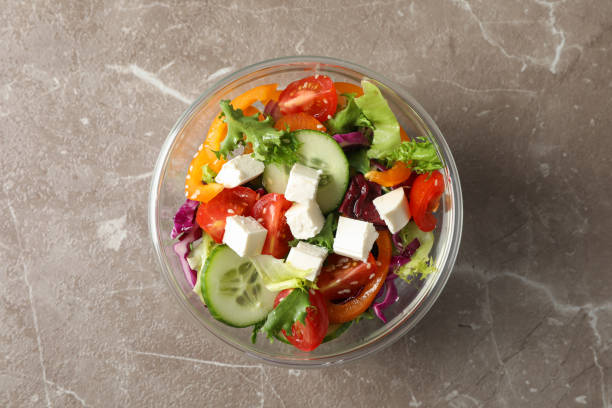 istock Glass bowl with fresh salad on grey background, copy space 1178945973