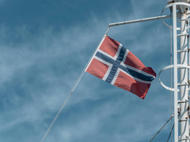 istock Norway flag waving on ship with blue sky as background 1178946324