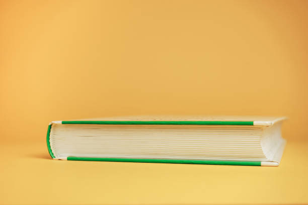 istock Close up Beautiful new book on a yellow background. 1178946348