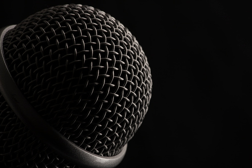 Microphone on green background.