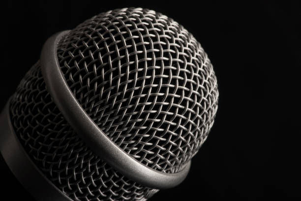 istock Close up head audio microphone in black background with copy space on the right 1178948980