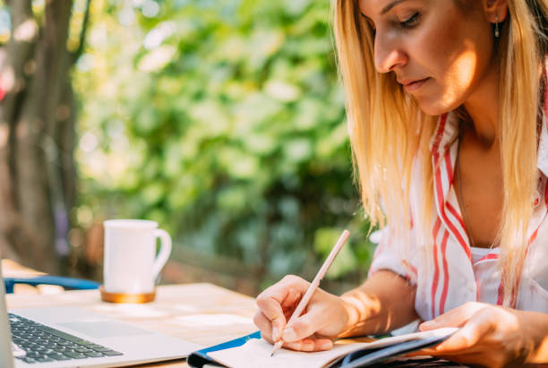 istock Blond Woman Working in Cafe Freelance 1178949768