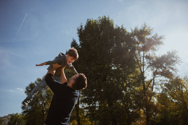 istock Father and Son having fun in the park 1178951197