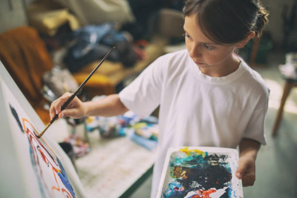 istock Boy working and painting in art studio 1178952627