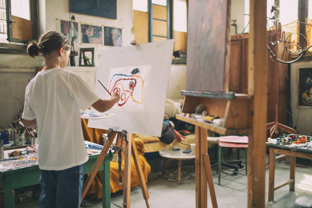 istock Boy working and painting in art studio 1178952712