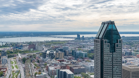 Montreal in Canada, aerial view with the tallest skyscraper and the Saint-Laurent river