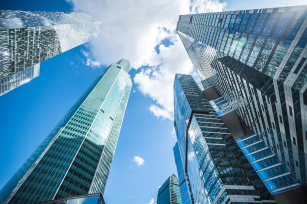 istock Business background. Modern office buildings under blue sky. 1178954032