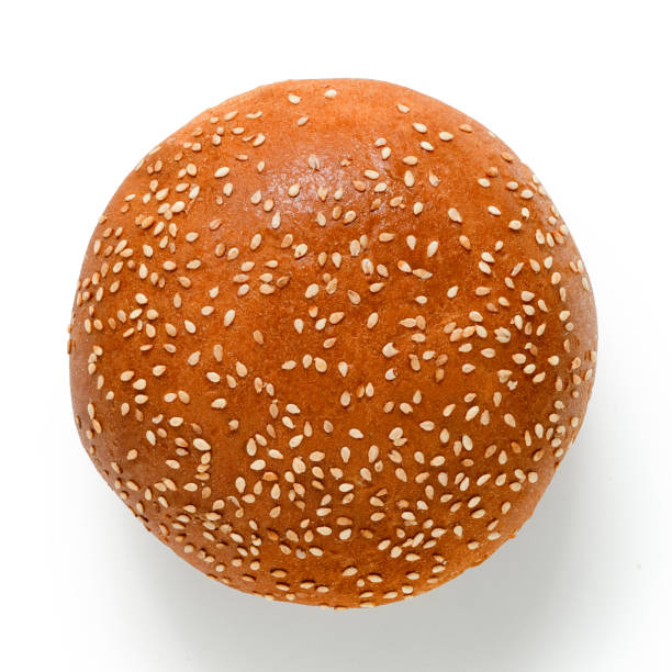 istock Sesame seed hamburger bun isolated on white. Top view. 1178954509