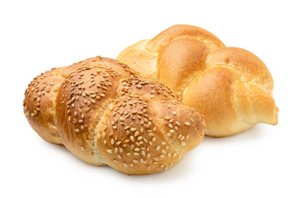 istock Two plaited white bread rolls isolated on white. Plain and with sesame seeds. 1178955456