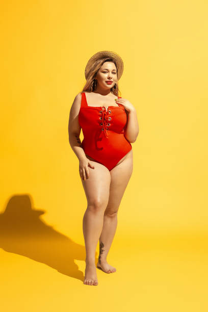 istock Young caucasian plus size female model's preparing for beach resort 1178957552
