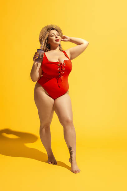 istock Young caucasian plus size female model's preparing for beach resort 1178957558