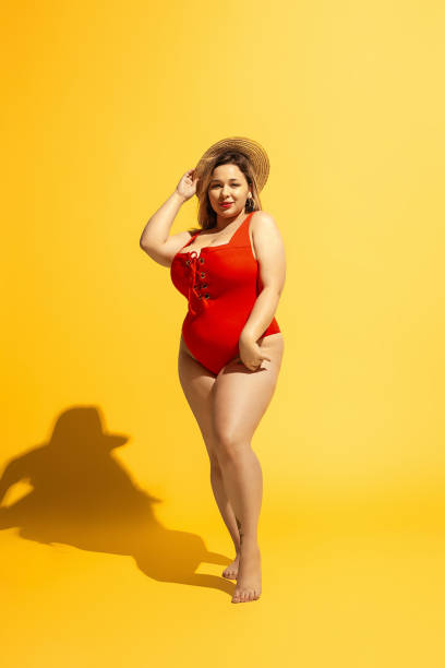 istock Young caucasian plus size female model's preparing for beach resort 1178957570