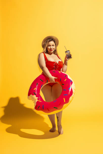 istock Young caucasian plus size female model's preparing for beach resort 1178957578