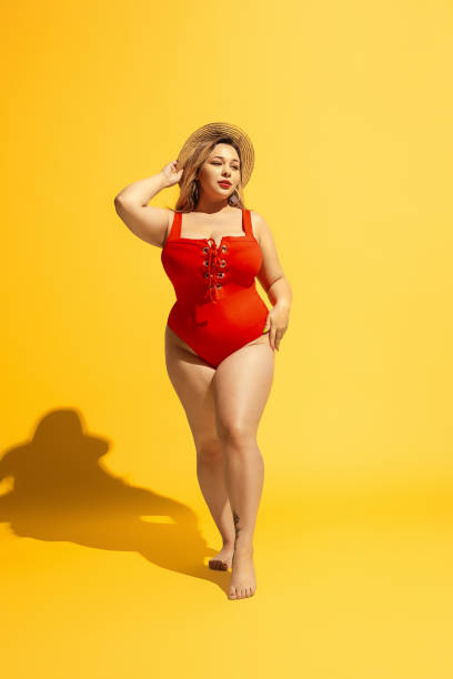 istock Young caucasian plus size female model's preparing for beach resort 1178957612